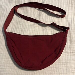 Burgundy Uniqlo crescent bag
